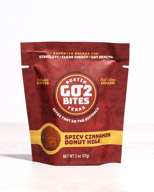 Red package of Austin GO2 Bites Spicy Cinnamon Donut Hole on a white background
