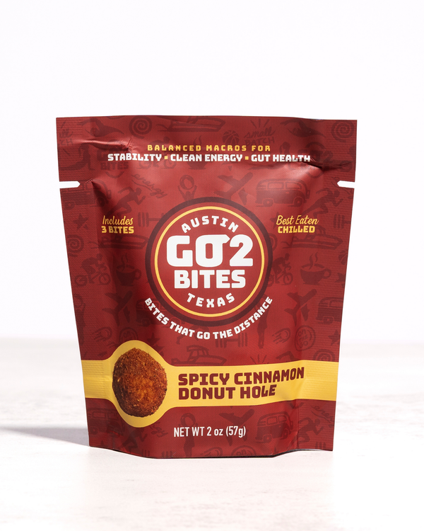 Red package of Austin GO2 Bites Spicy Cinnamon Donut Hole on a white background